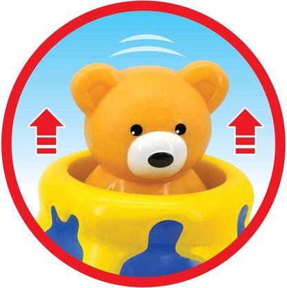 Pop-up bear figure on activity piano with blue arrows