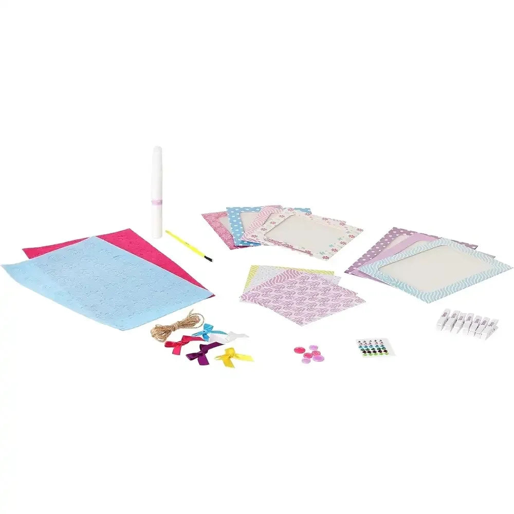 Mini frame craft kit materials: patterned paper frames, stickers, and small accessories