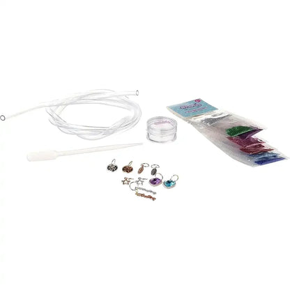 Water bracelet craft set contents with charms, beads, rings, and clear cord
