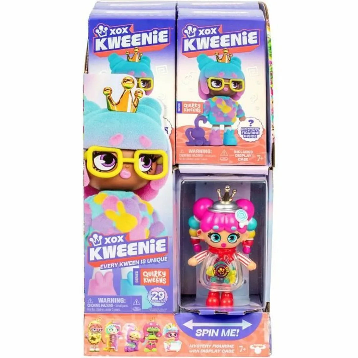 Boxed toy doll with gold crown and round glasses, colorful outfit visible through window