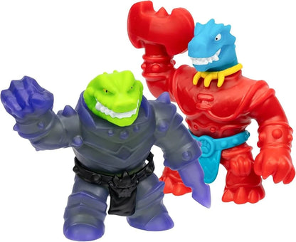 Two monster action figures: red squishy with blue jaw, and green-and-purple stretchy figure