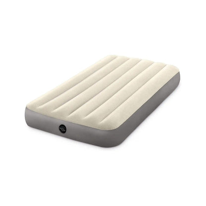 Twin airbed with cream raised baffles, gray sides, and circular valve visible