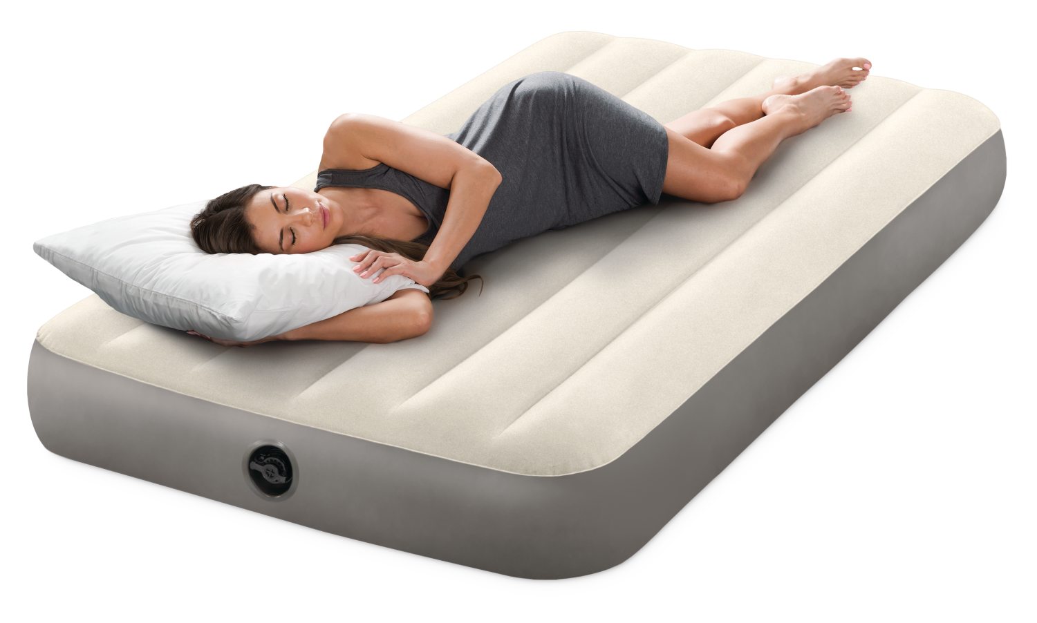 Twin airbed with cream baffle top and gray sides, shown with person lying on it