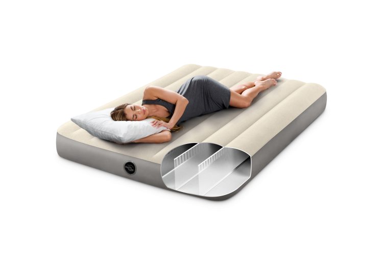 Single airbed with ribbed beige top and gray sides, valve visible; people resting
