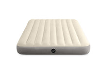 Single-high airbed, cream top with vertical channels and dark gray sides, round valve
