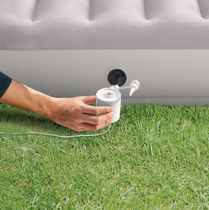 White twin air mattress with valve and connected pump, ribbed top