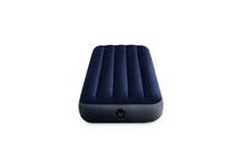 Twin inflatable airbed in dark navy blue with quilted sections and valve on base