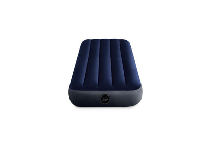Twin inflatable airbed in dark navy blue with quilted sections and valve on base