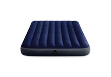 Dark blue airbed with ribbed top and round valve on the side
