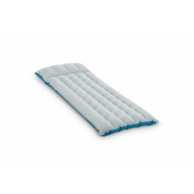 Camping mat with light gray quilted padding and blue edge trim