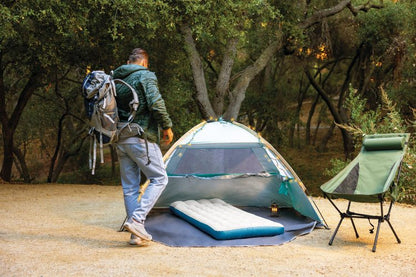 Camping mat inside tent, gray surface with blue border