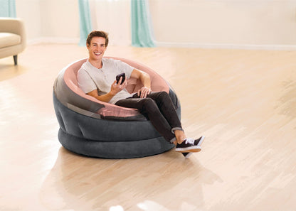 Round beanbag chair with dark gray outer and soft pink inner cushion