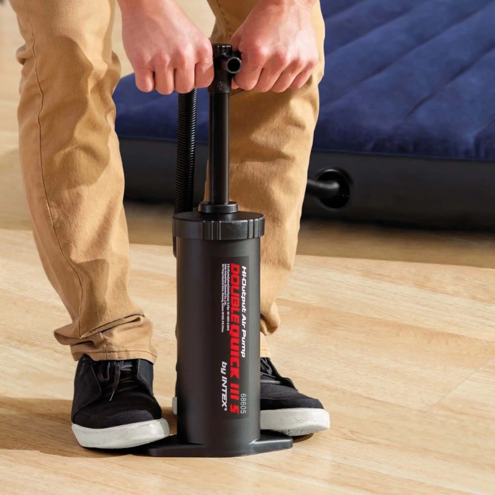 Hand air pump being operated by hands for inflating shoes