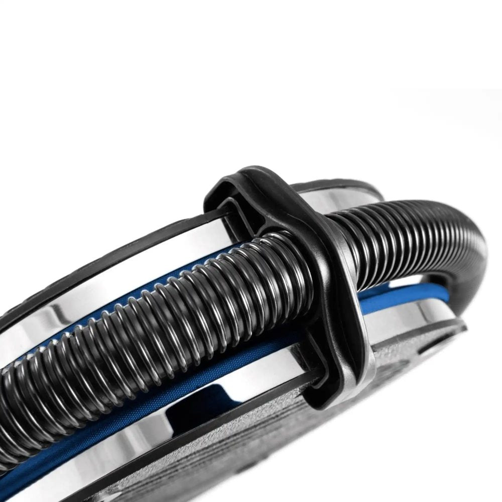 Bellows foot pump close-up of black spring coil and blue base with inlet