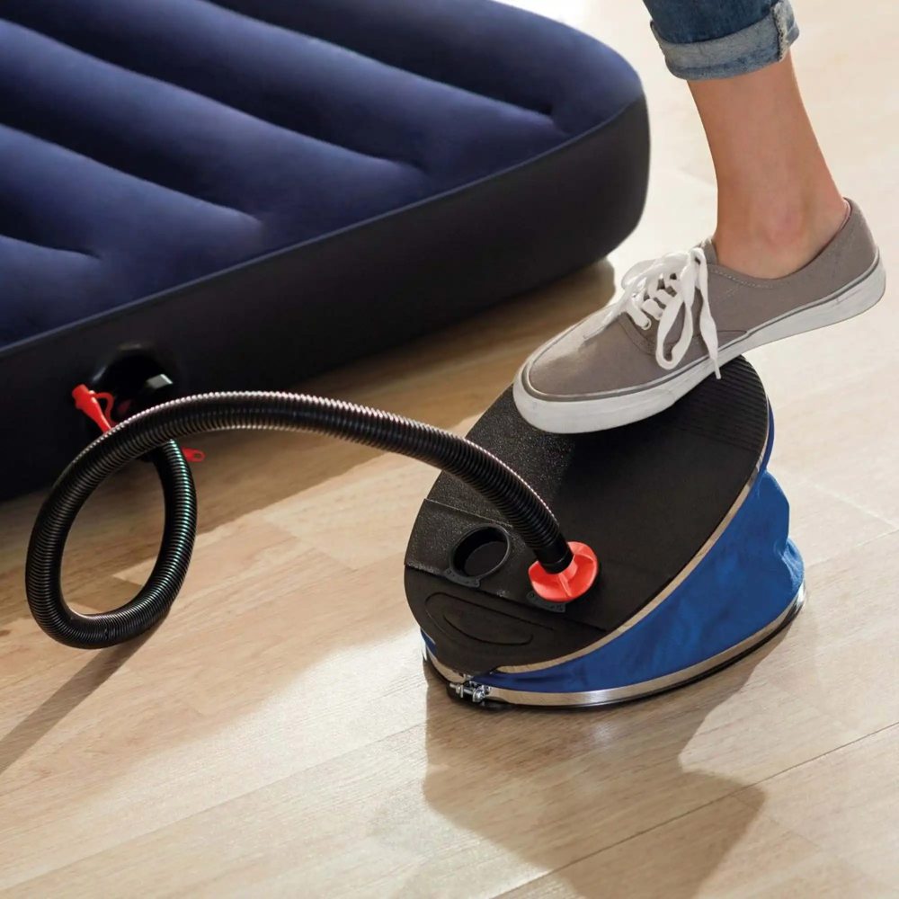 Bellows foot pump being pressed by shoe on blue base