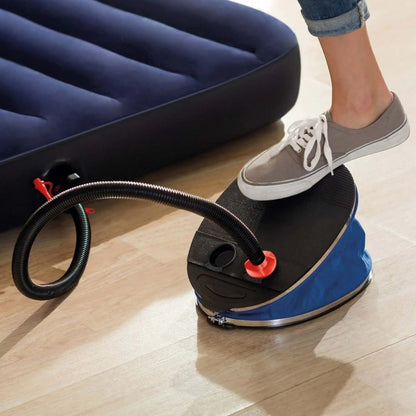 Bellows foot pump being pressed by shoe on blue base