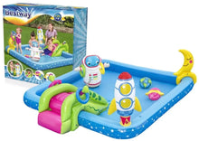 Inflatable astronaut play pool with blue base, astronaut figures, and green/pink slide