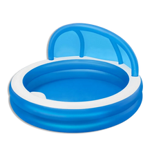 Round inflatable pool with blue basin, white rim, and arched handles