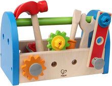 Hape Fix-It Tool Box: wooden workbench with red hammer, blue frame, gear wheels.