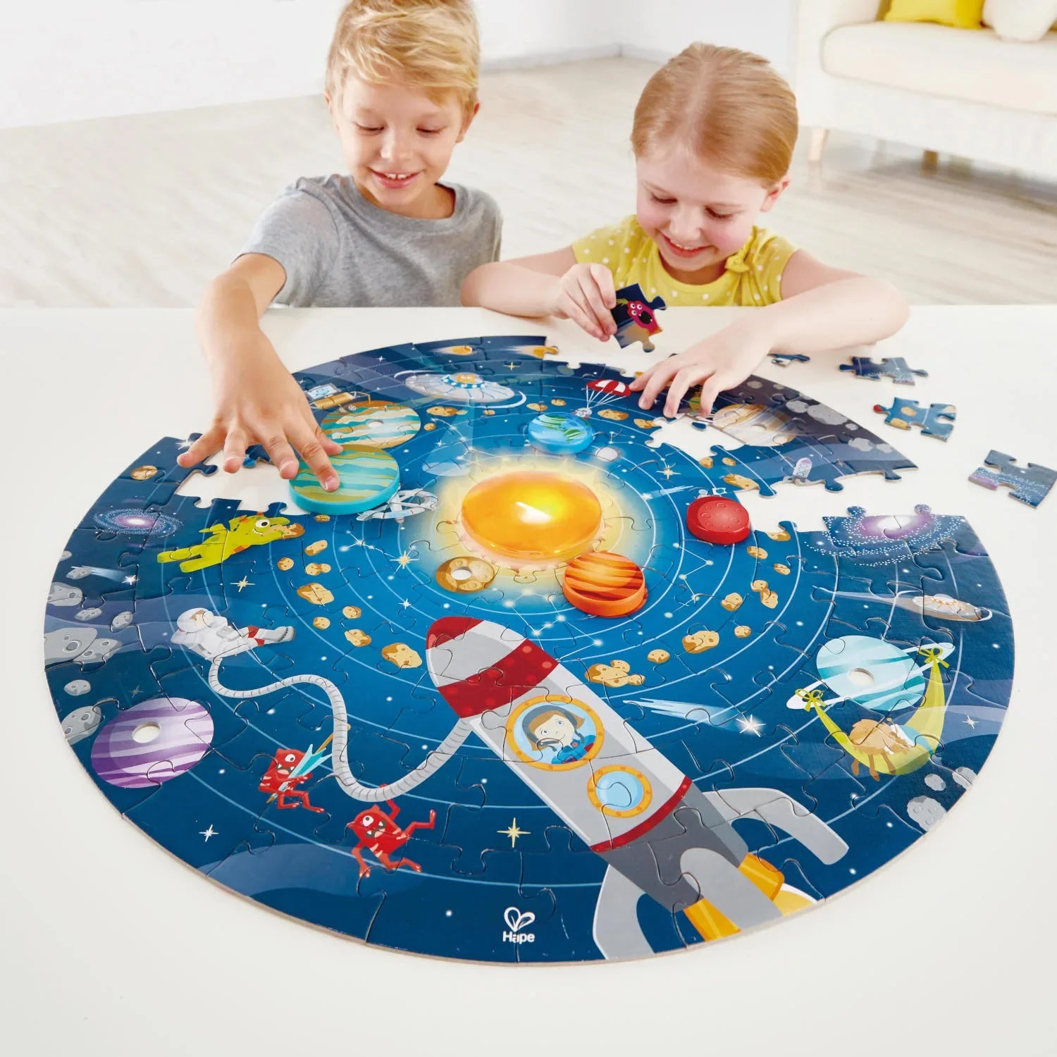 Solar System Puzzle on circular mat with space-themed pieces and rocket path