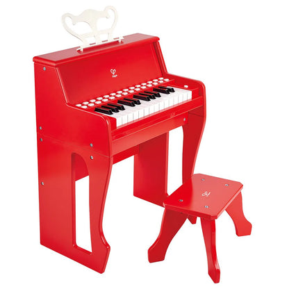 Rotes Kinderklavier-Spielzeug mit weißen und schwarzen Tasten sowie Hocker