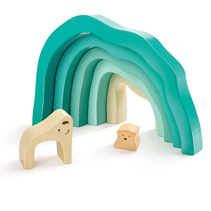 Teal arched stacking blocks with two light wood polar bear pieces and wooden cubes