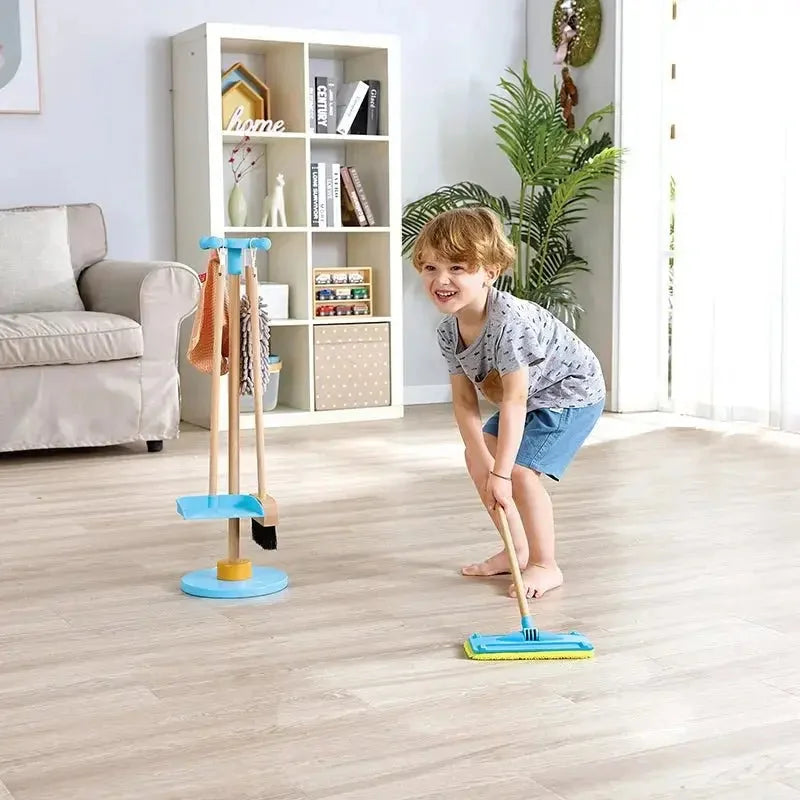 Broom and Swiffer-style cleaning stand with mop and brush on base, shown in use