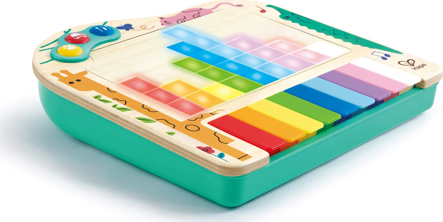 Colorful pixel piano toy with green base, multicolor key grid and piano-style buttons