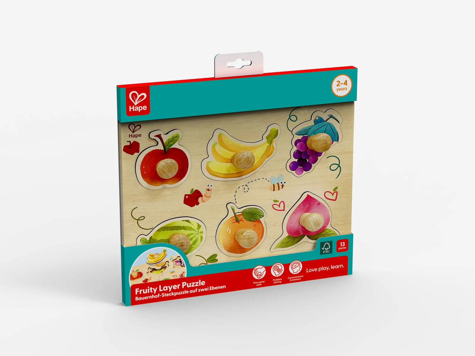Hape Fruity Layer Puzzle board game with fruit-shaped wooden pieces in box