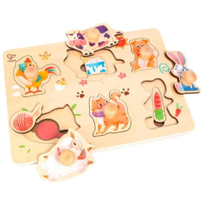 Farmyard layer wooden puzzle with colorful animal pieces and tray-style cutouts