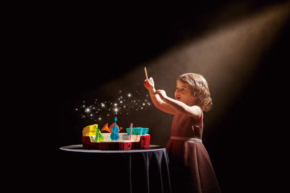 Mini conductor’s orchestra musical toy with colorful instrument pieces on tabletop