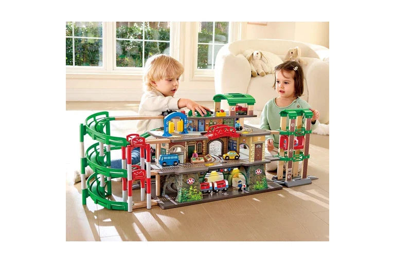 Multi-level railway city playset with station, bridges, cars and green/red tracks
