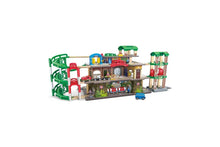 Multi-level railway city set with green and red tracks and station buildings