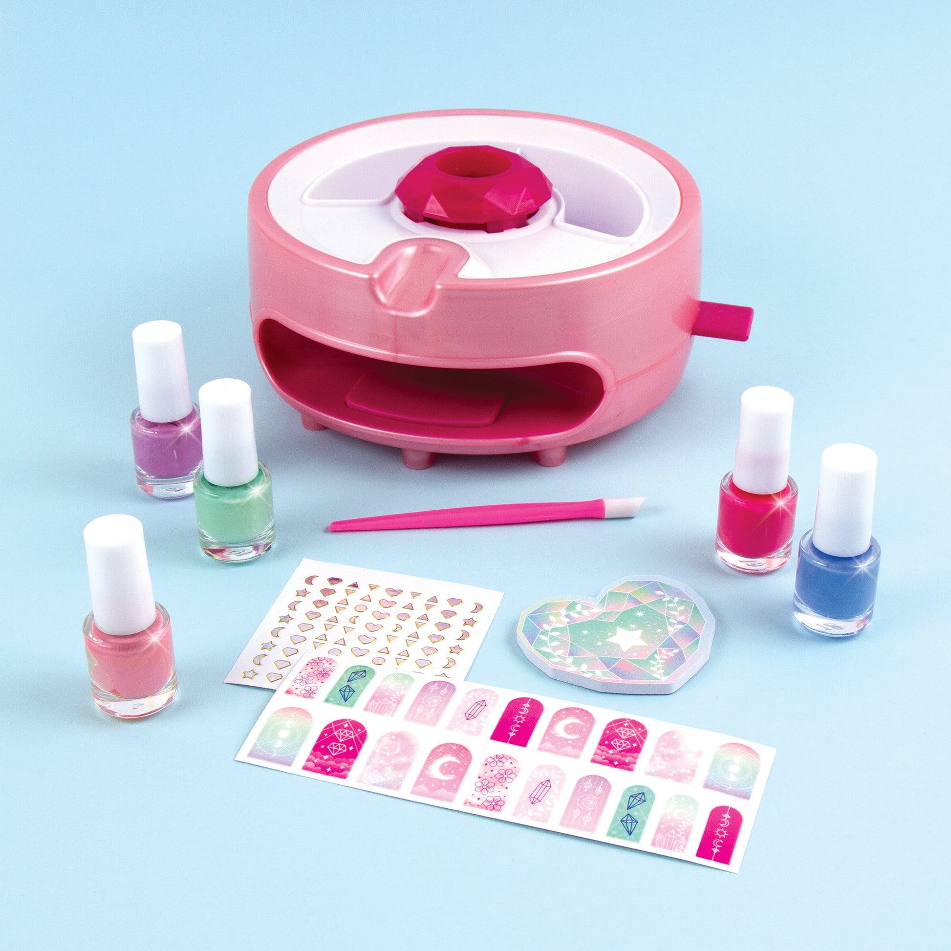 Pink nail dryer base with polish bottles, stickers and nail art pen