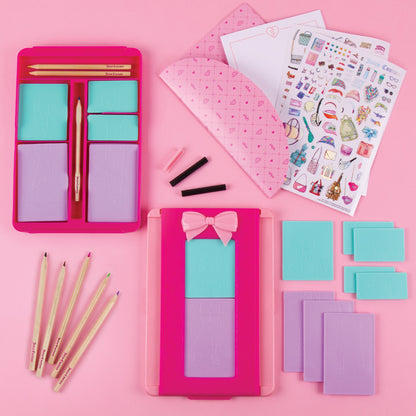 Fashion Exchange kit with pink case, blue and purple plates, pencils, and stencils