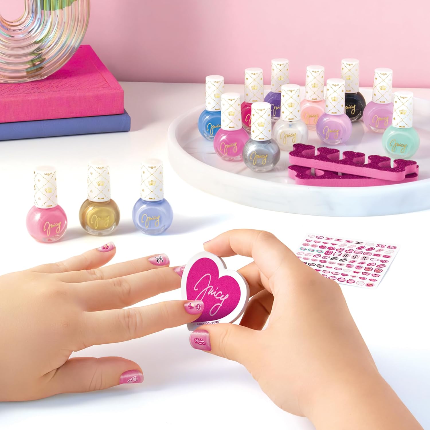 Nail polish bottles with heart-shaped nail sticker on applicator, plus sticker sheet