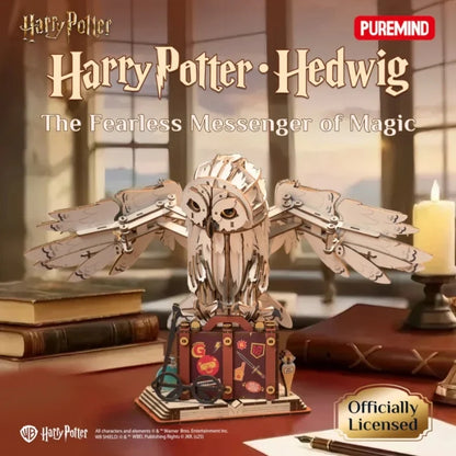 Wooden owl diorama figure with outstretched wings and a themed suitcase carriage on base
