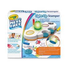 Light-up stamper set in retail box, with colorful stamp pads and lit stamper.