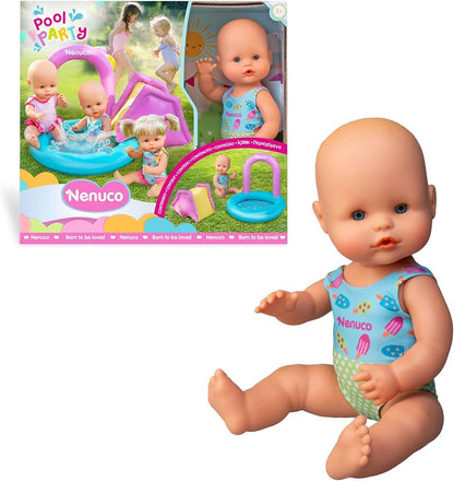Baby doll with blue pool-print romper and bare head, posed kneeling