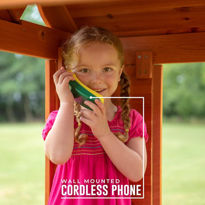 Wall-mounted cordless phone on interior wall of cedar playhouse