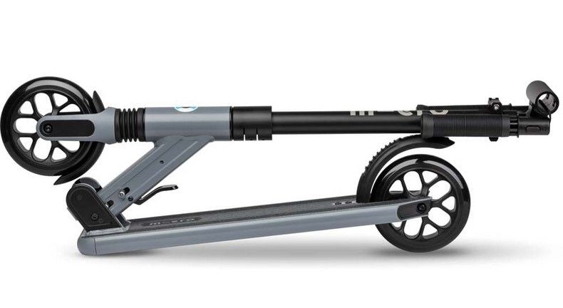 Dark gray kick scooter side view with black suspension stem and large wheels