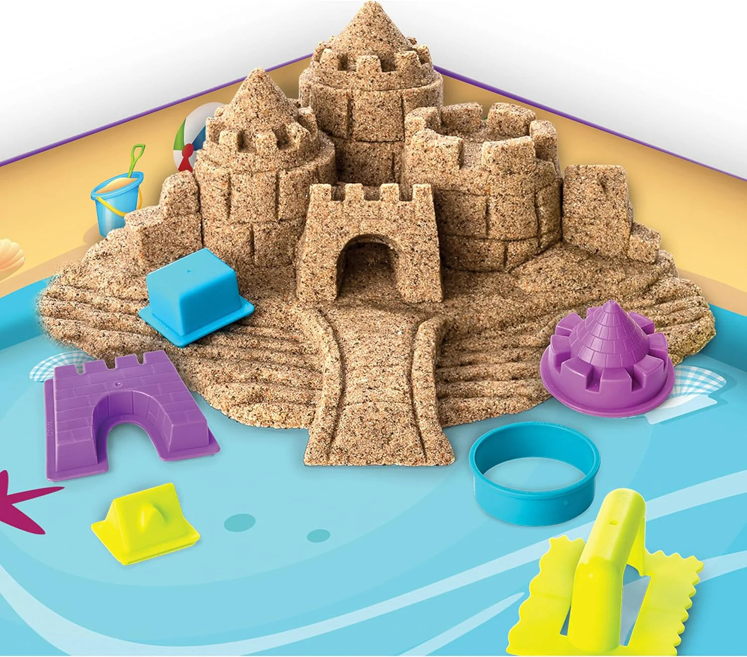 Beach Day sandcastle with colorful plastic molds and blue sand containers