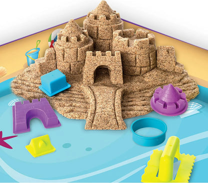 Beach Day sandcastle with colorful plastic molds and blue sand containers