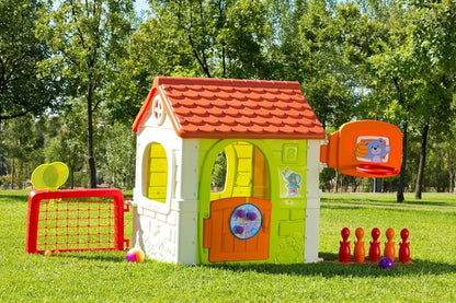 Kids plastic playhouse with red roof, green walls, and outdoor activity accessories