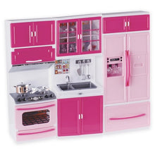 Pink and white doll kitchen playset with oven, sink, shelves, and refrigerator