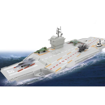 Aircraft carrier toy with gray deck, green helicopters, and black jet