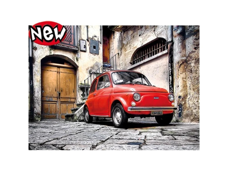 500-piece puzzle featuring a red Fiat 500 in a narrow street scene