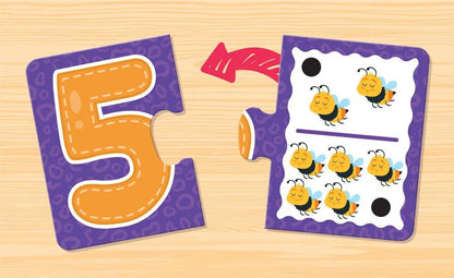 Purple and orange foam puzzle pieces forming number 5 with chick illustrations