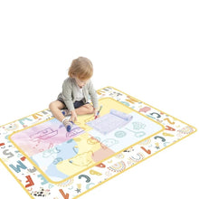 Kids magic water play mat as a child uses the water pen to reveal pictures