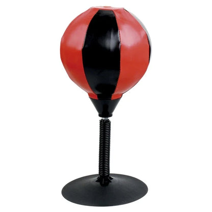 Red and black table punching ball with black spring stem on weighted base